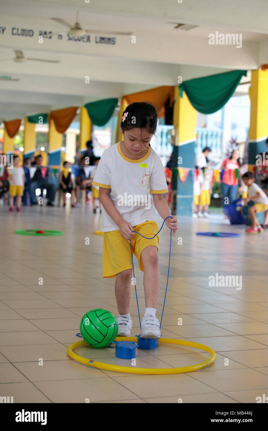 Children playing the walk the clog game at their kindergarten sport day ...