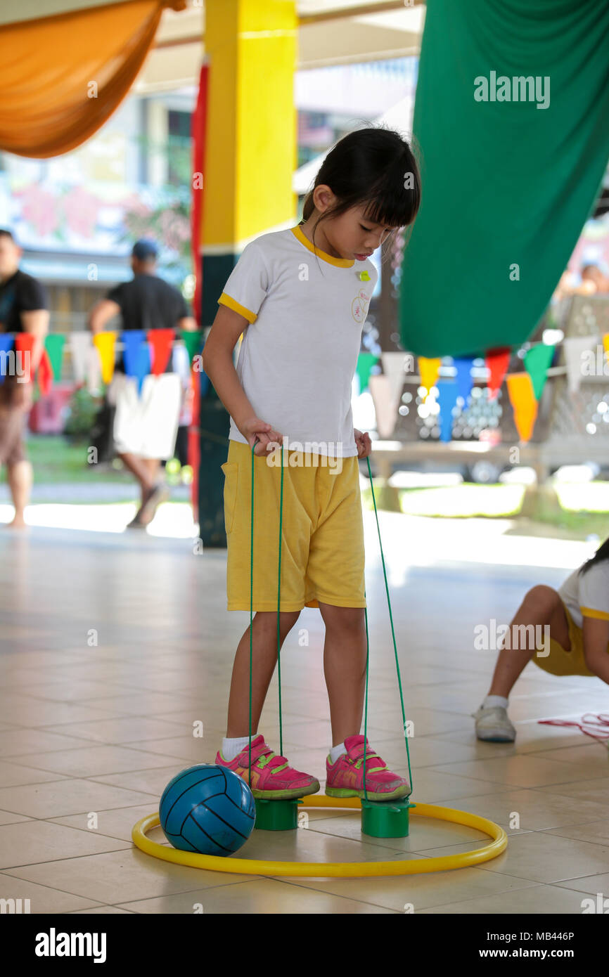 Children playing the walk the clog game at their kindergarten sport day ...