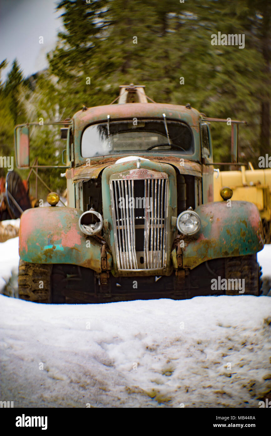 A 1942 White Super Power 2 1/2 ton winch truck in a wooded area, in Noxon, Montana  This image was shot with an antique Petzval lens and will show sig Stock Photo