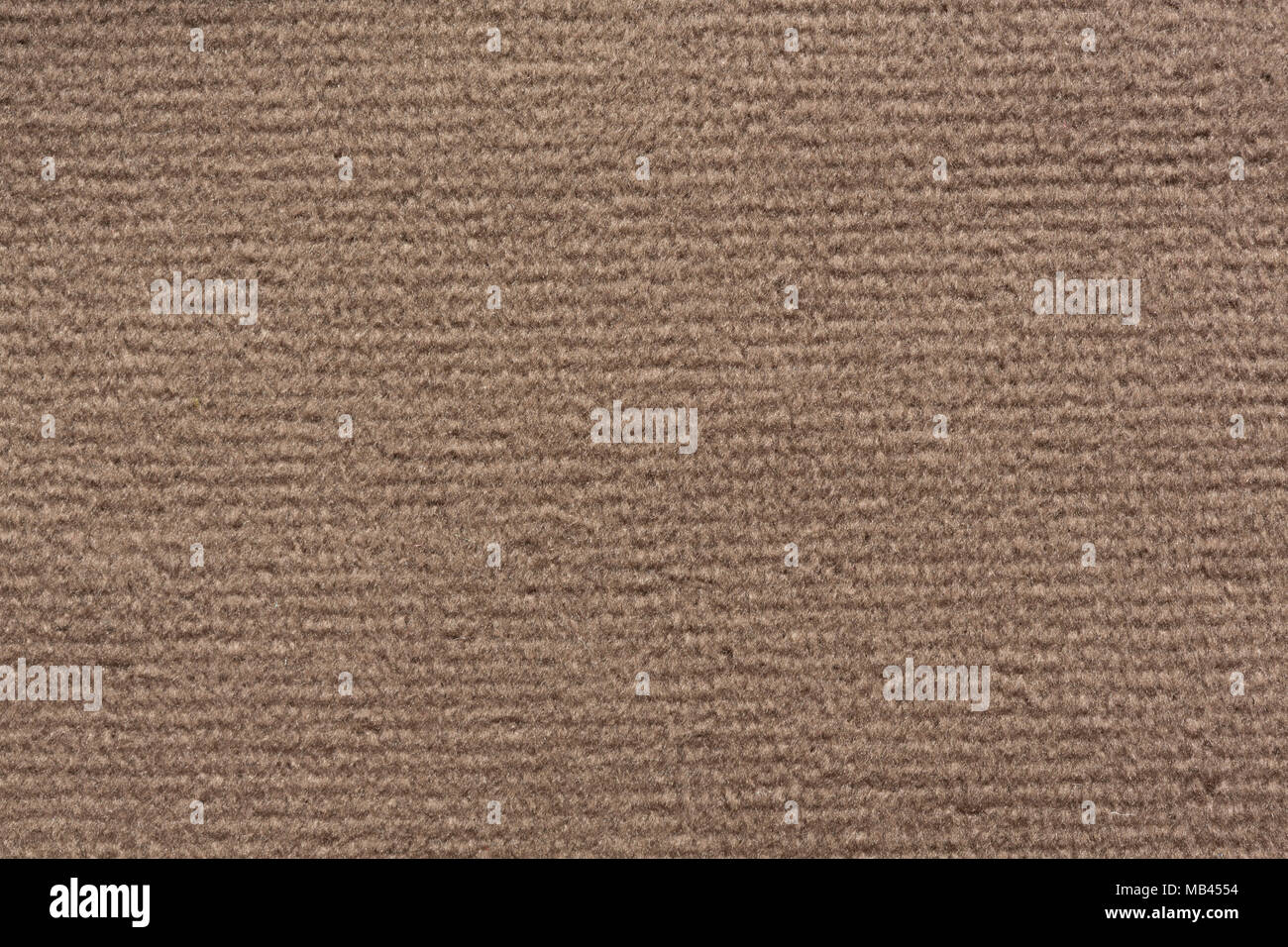 Relief fabric texture in soft brown colour. Stock Photo
