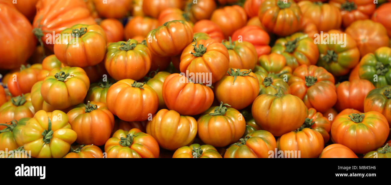 background of ripe tomatoes for sale at the vegetable market Stock ...