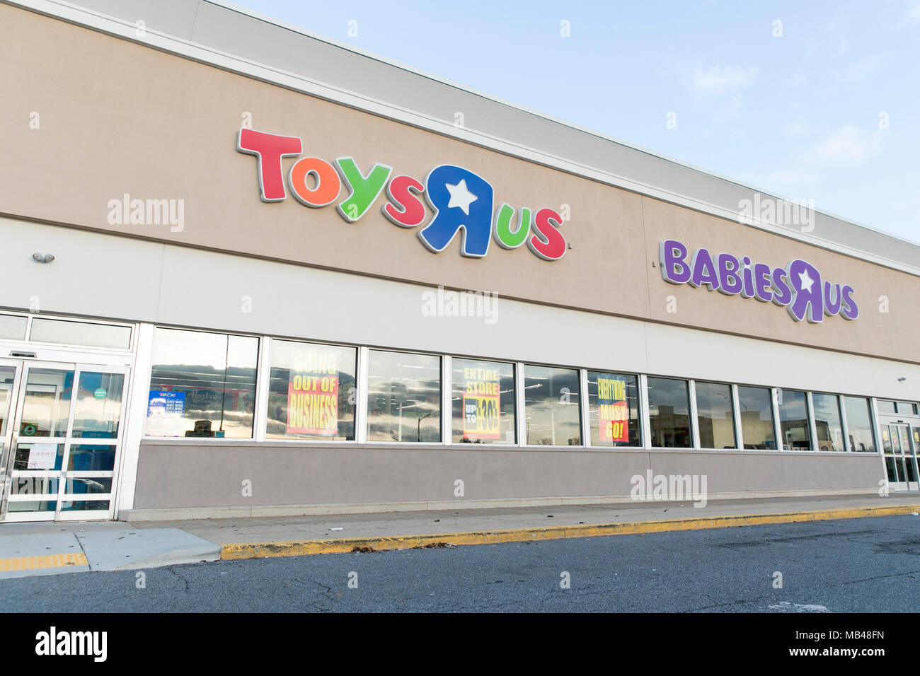 Frederick, Maryland, USA. 5th Apr, 2018. A logo sign outside of a Toys 'R' Us retail store in Hagerstown, Maryland with 'Going Out Of Business' signage on April 5, 2018. The toy retailer, which has struggled under a heavy debt load, announced its bankruptcy and plan to liquidate all of its stores in March. Credit: Kristoffer Tripplaar/Alamy Live News Stock Photo