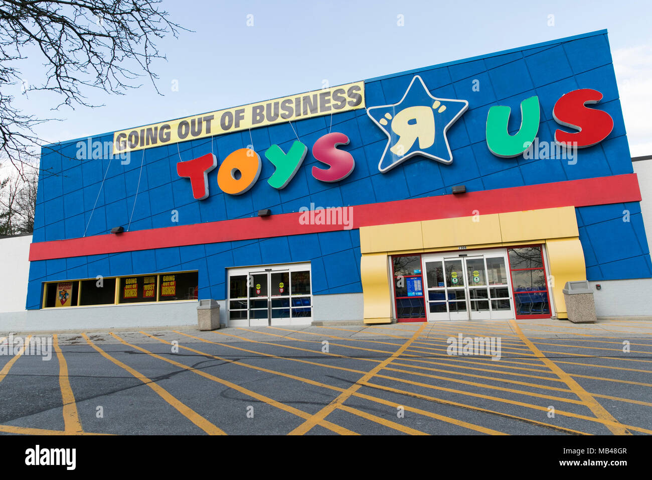 Frederick, Maryland, USA. 5th Apr, 2018. A logo sign outside of a Toys 'R' Us retail store in Frederick, Maryland with 'Going Out Of Business' signage on April 5, 2018. The toy retailer, which has struggled under a heavy debt load, announced its bankruptcy and plan to liquidate all of its stores in March. Credit: Kristoffer Tripplaar/Alamy Live News Stock Photo