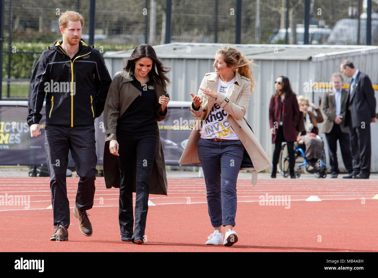 Bath, UK. 6th April, 2018. Prince Harry (L), Meghan Markle (centre) are pictured talking to the Invictus Games UK Team Chef de Mission Jayne Kavanagh (R) at the University of Bath Sports Training Village as they attend the UK team trials for the 2018 Invictus Games. The games are a sporting event for injured active duty and veteran service members, 500 competitors from 18 nations will compete in 11 adaptive sports in this year's Invictus Games which will be held in Sydney, Australia in October 2018. Credit: lynchpics/Alamy Live News Stock Photo