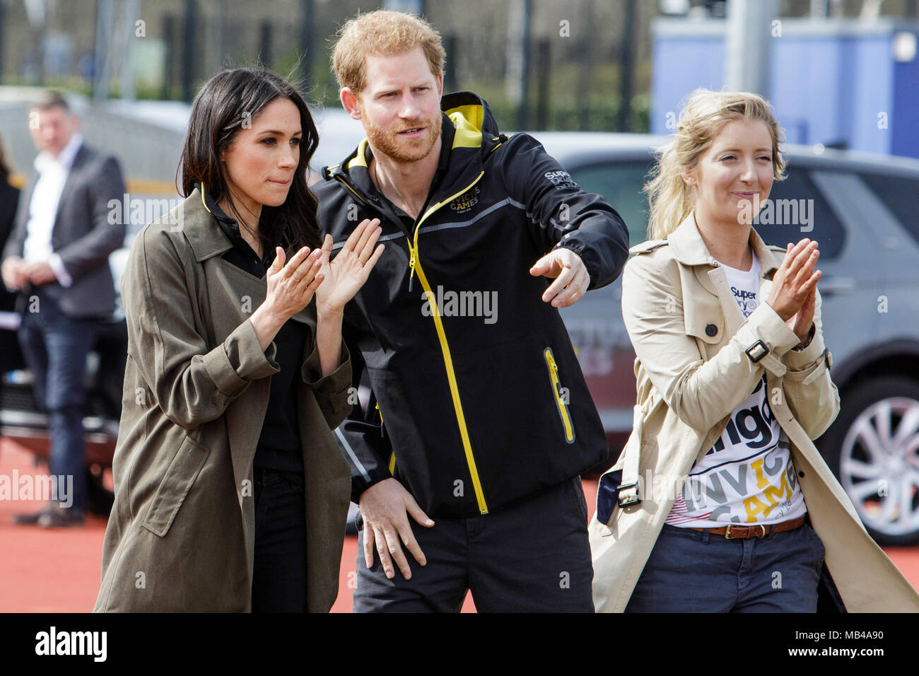 Bath, UK. 6th April, 2018. Prince Harry (centre), Meghan Markle (L) are pictured with the Invictus Games UK Team Chef de Mission Jayne Kavanagh (R) at the University of Bath Sports Training Village as they attend the UK team trials for the 2018 Invictus Games. The games are a sporting event for injured active duty and veteran service members, 500 competitors from 18 nations will compete in 11 adaptive sports in this year's Invictus Games which will be held in Sydney, Australia in October 2018. Credit: lynchpics/Alamy Live News Stock Photo