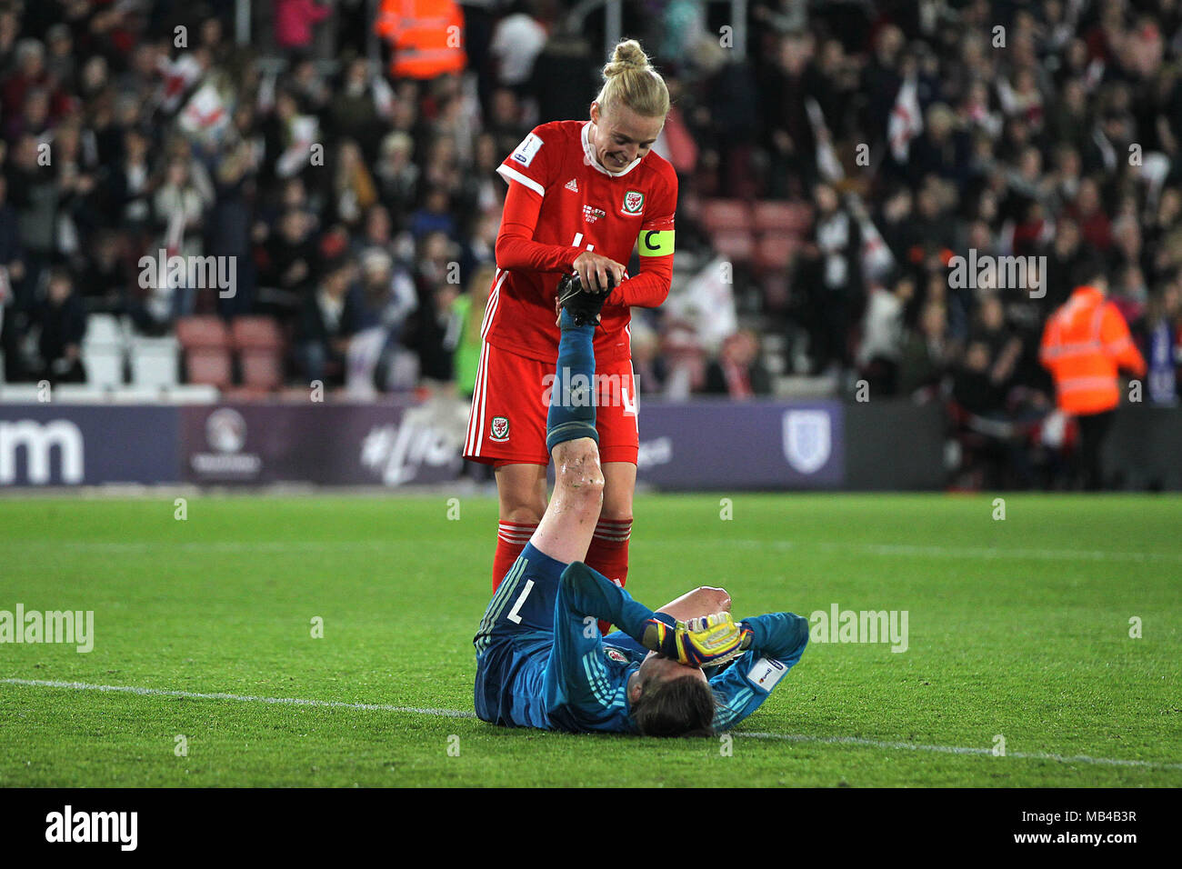 Southampton, UK. 6th Apr, 2018. Laura O'Sullivan of Wales receives treatment from Sophie Ingle of Wales during the FIFA World Cup 2019 Qualifying Group 1 match between England Women and Wales Women at St Mary's Stadium on April 6th 2018 in Southampton, England. (Photo by Matt Bradshaw/phcimages.com) Credit: PHC Images/Alamy Live News Stock Photo
