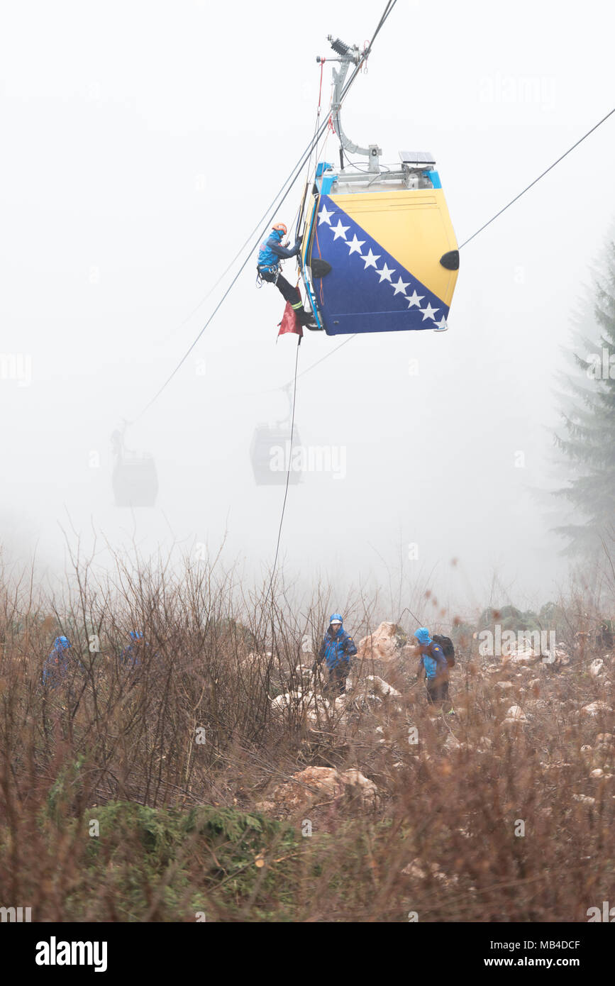 Trebevicka Zicara, Sarajevo, Bosnia and Herzegovina - April 05 2018: Exercise on Gondola Lift Car - Alpinist Is Rescue People From Gondola That Are Stuck Stock Photo