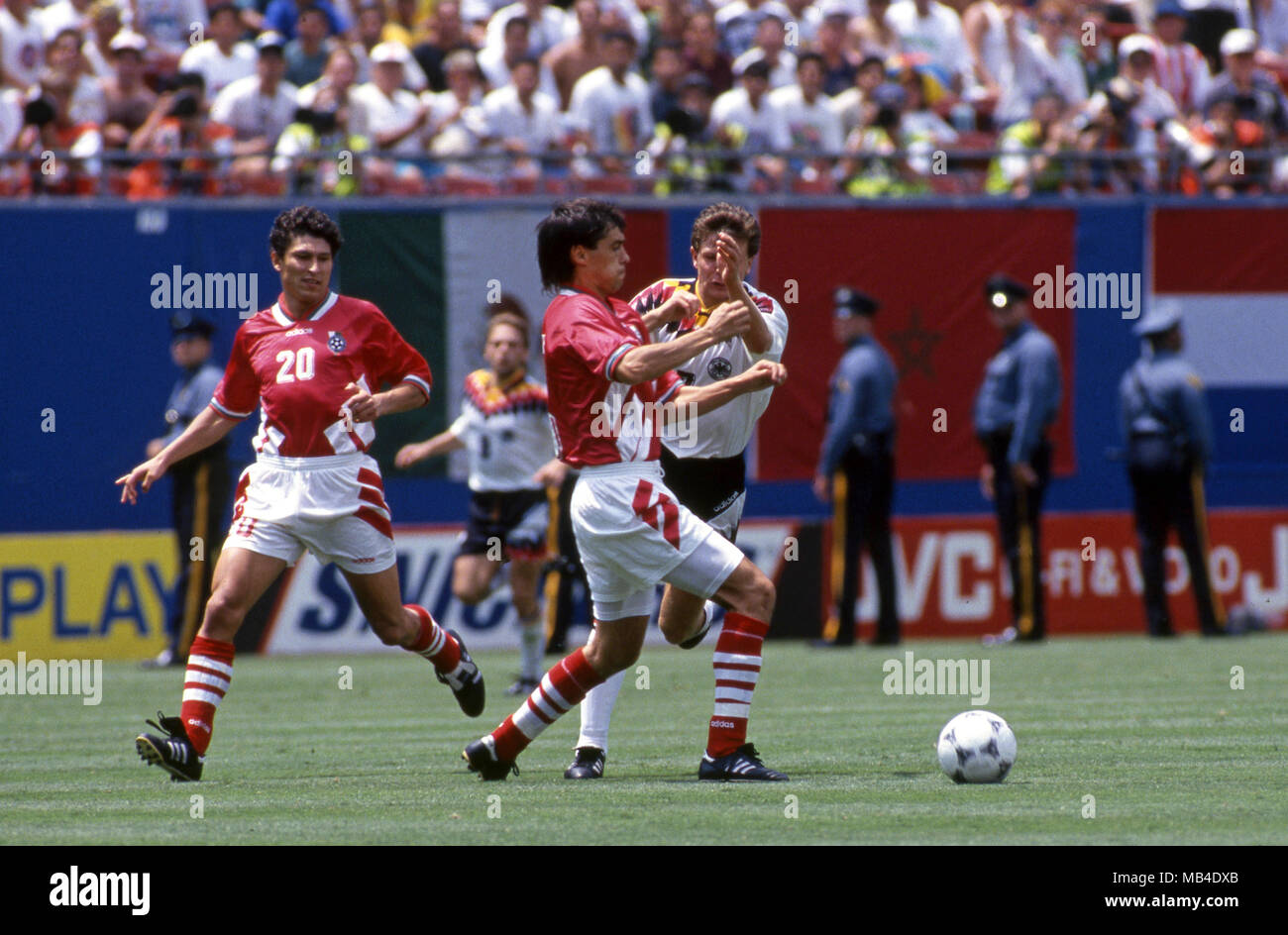 FIFA World Cup - USA 1994 10.7.1994, Giants Stadium, New York/New Jersey. World Cup Quarter Final, Bulgaria v Germany. Petar Houbchev (Bulgaria) v Andreas Mler (Germany). On left Krassimir Balakov. Stock Photo