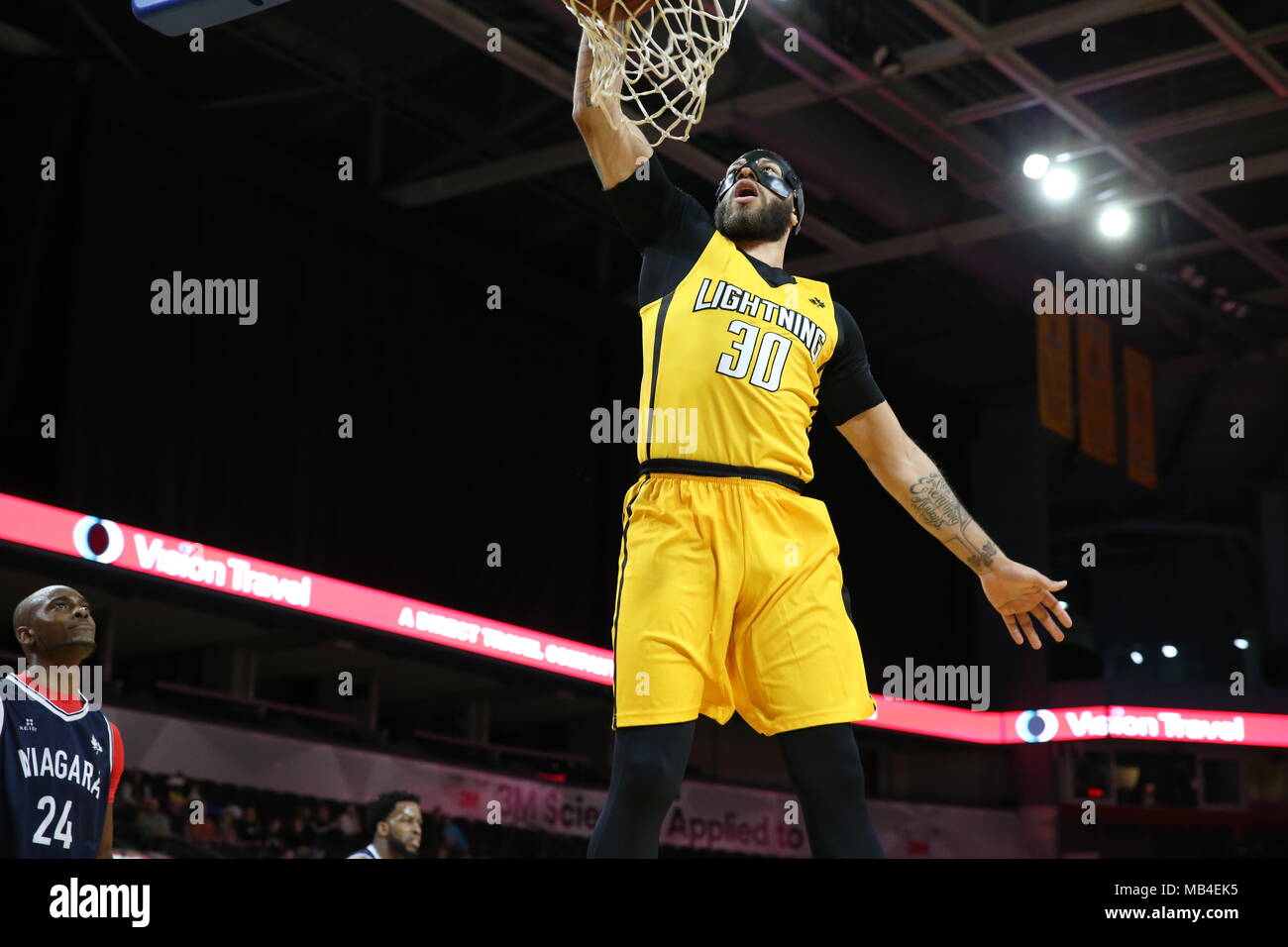 Ontario, Canada.6th April 2018, London, Ontario, Canada.  The London Lightning and the Niagara River Lions battled it out in rough and physical game one of the NBL playoff.  After the game the only hand shake was by the 2 coaches.  London Dominated the game winning 151-115, Doug Herring Jr.(9) and Garrett Williamson(15) both lead the in scoring with 22 points each.   Luke Durda/Alamy Live News Credit: Luke Durda/Alamy Live News Stock Photo