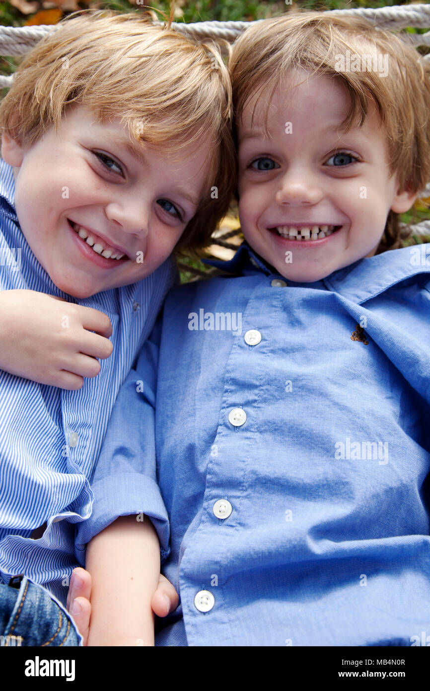 Half-Length Portrait of Two Smiling Boys in Hammock Stock Photo - Alamy