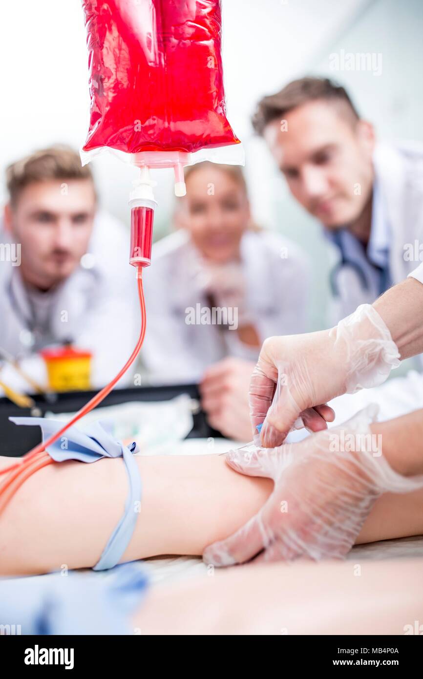 Model released doctor practising inserting an iv intravenous line on
