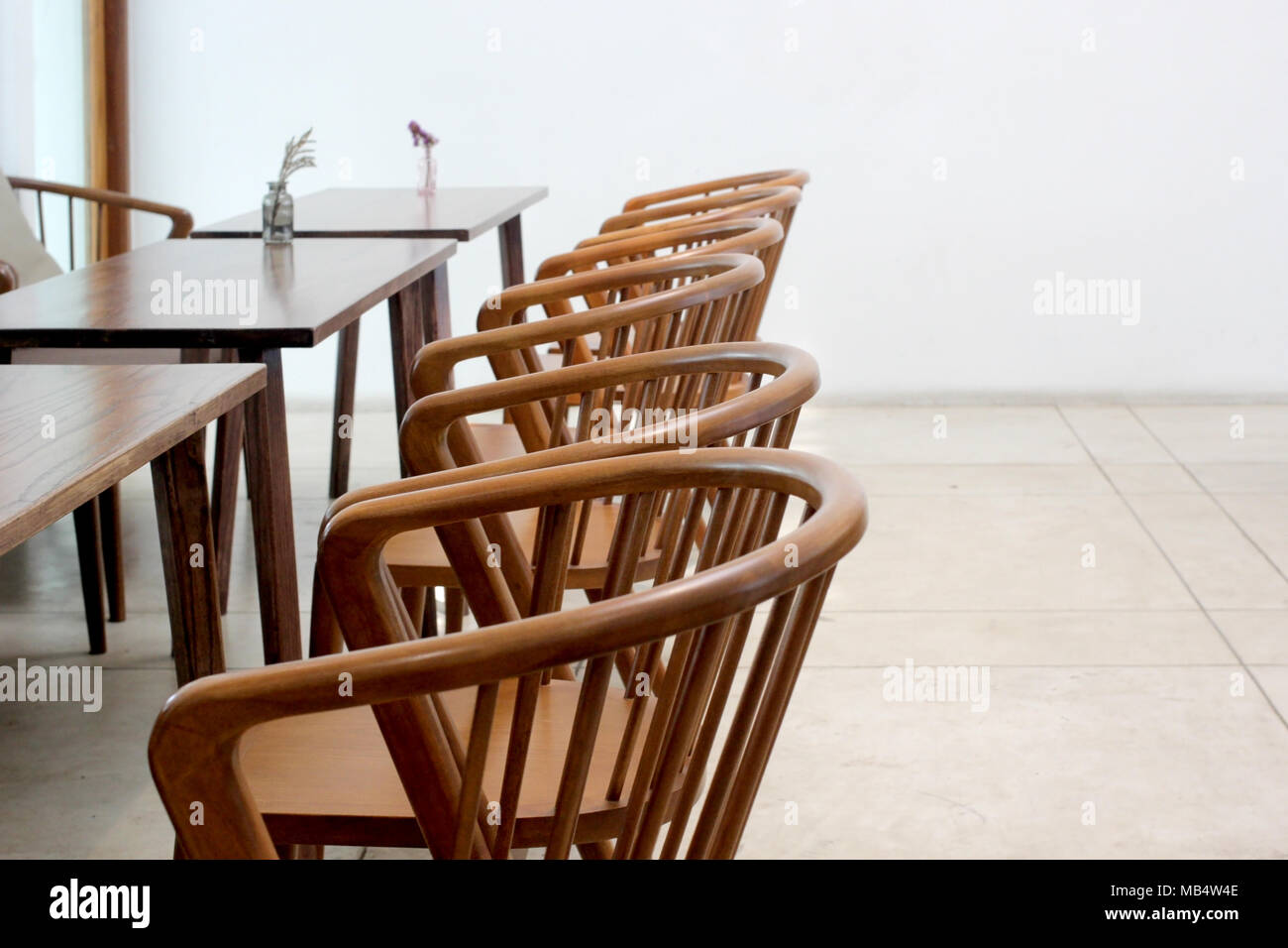 empty wooden table and chair in modern restaurant Stock Photo - Alamy