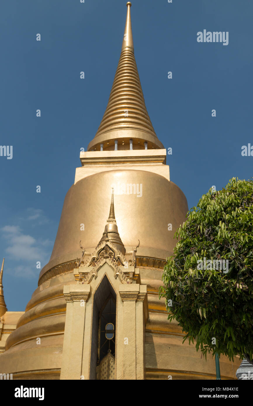 Elaborately decorated and detailed temples and stupa in the Grand Palace, Bangkok, Thailand. Stock Photo