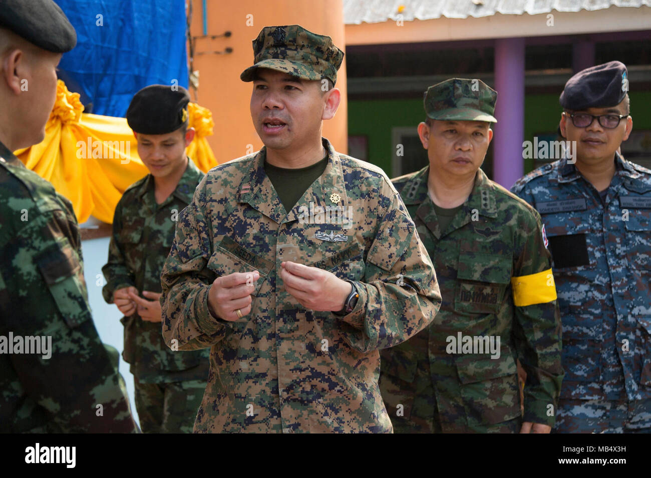 U.S. Navy Lt. Aroon Seeda speaks to the Royal Thai Army and Air Force, during Exercise Cobra Gold 2018 at Pong Ka Sang School in Nakhon Ratchasima, Kingdom of Thailand, Feb. 20, 2018. Chaplain Seeda was Born and raised in Pluak Daeng, Rayong province, Kingdom of Thailand as a Buddhist monk and immigrated to the United States in 2001 before joining the Navy Reserve in 2008. Humanitarian civic assistance projects conducted during the exercise support the needs and humanitarian interests of the Thai people. Cobra Gold 18 is an annual exercise conducted in the Kingdom of Thailand and runs from Feb Stock Photo
