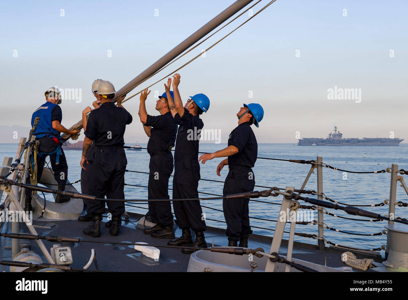 MANILA, Philippines (Feb. 20, 2018) Sailors remove a jackstaff on the ...