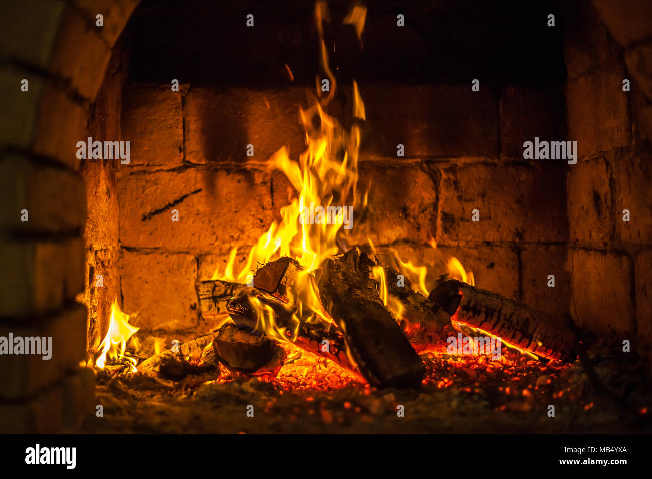 A fire burns in a fireplace Stock Photo - Alamy