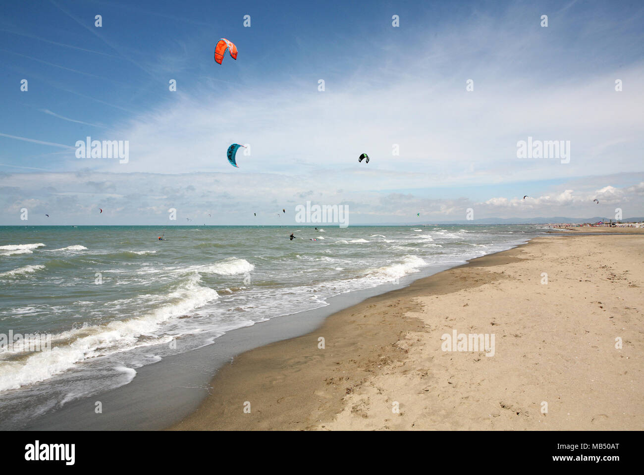 Kite surfers at the large sandy beach Stock Photo