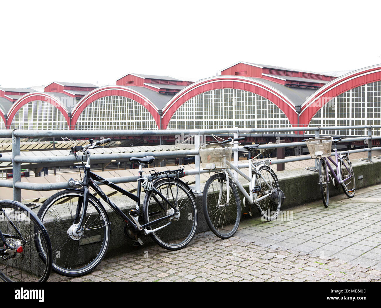 Bicycles parked outside Copenhagen H Central Railway station, Denmark Stock Photo