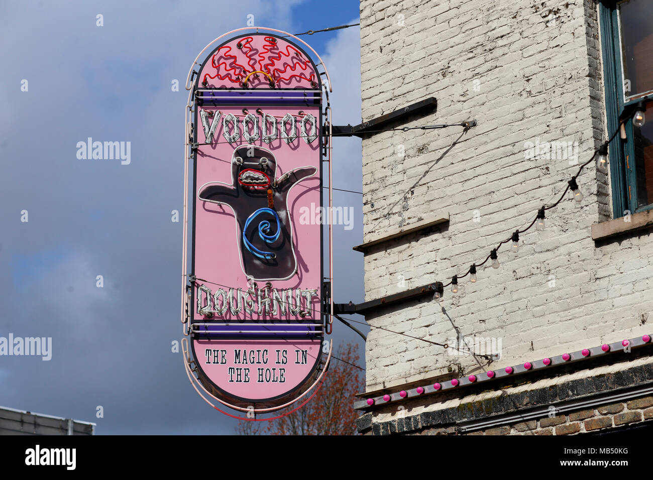 Voodoo Doughnut neon sign marquee at their flagship location in Old Town, Portland, Oregon. Stock Photo