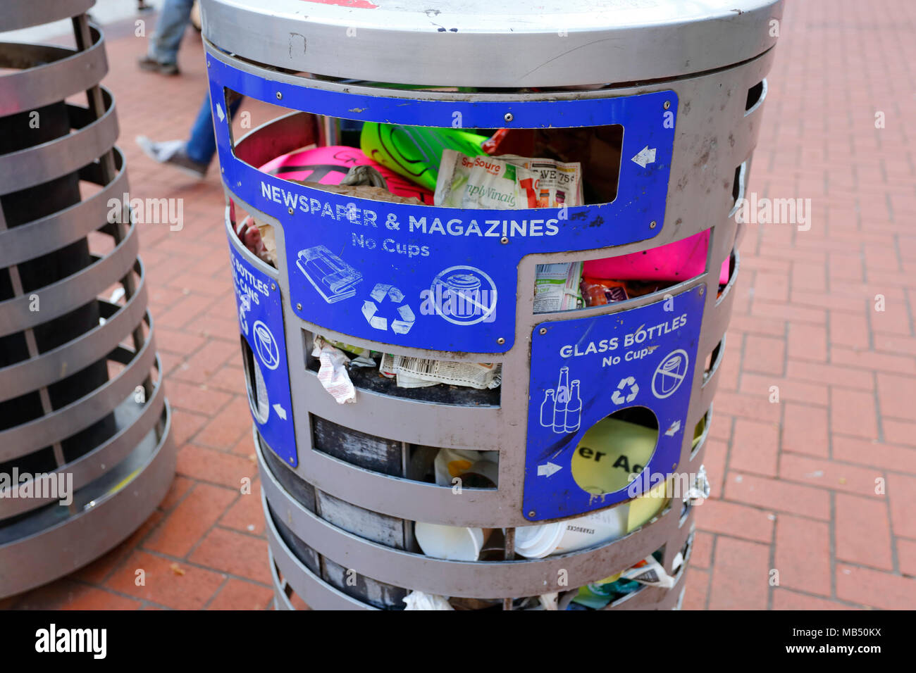 A recycling can in Portland, Oregon filled with trash and non
