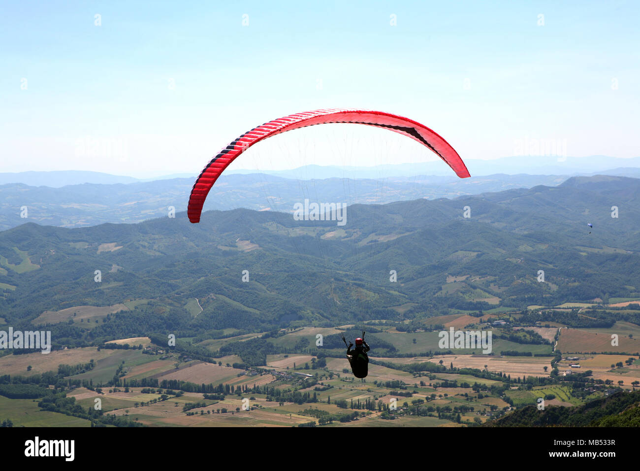 Paragliding in the mountains Stock Photo