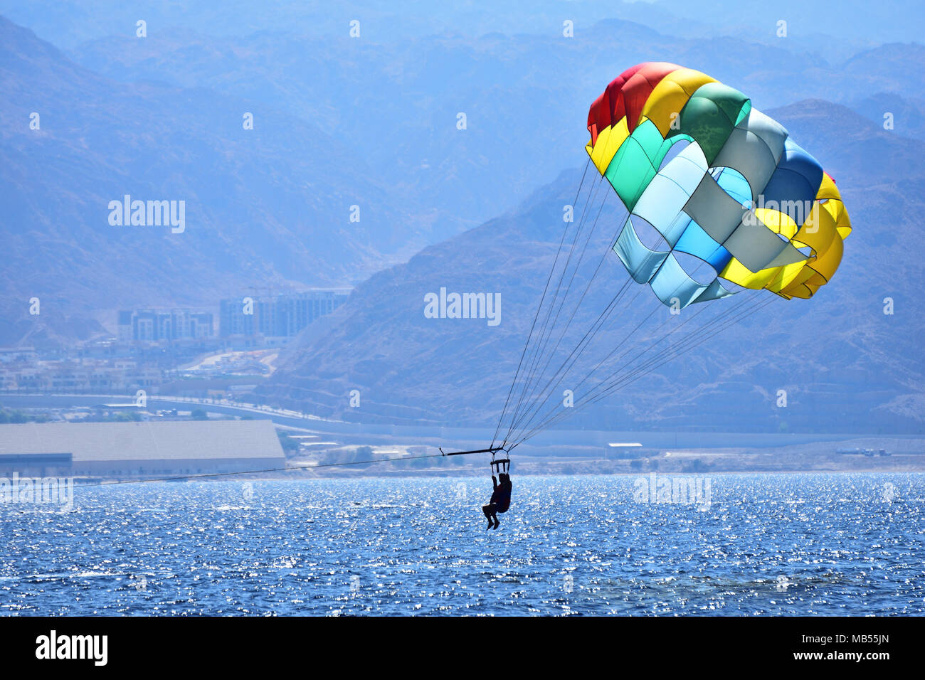 Parasailing entertainment at the beach of Eilat - israeli resort city at the red sea. Stock Photo