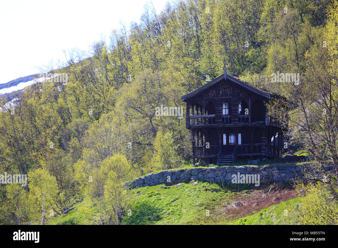 Picture of Traditional norwegian wooden house with woodcarving decor in spring ...