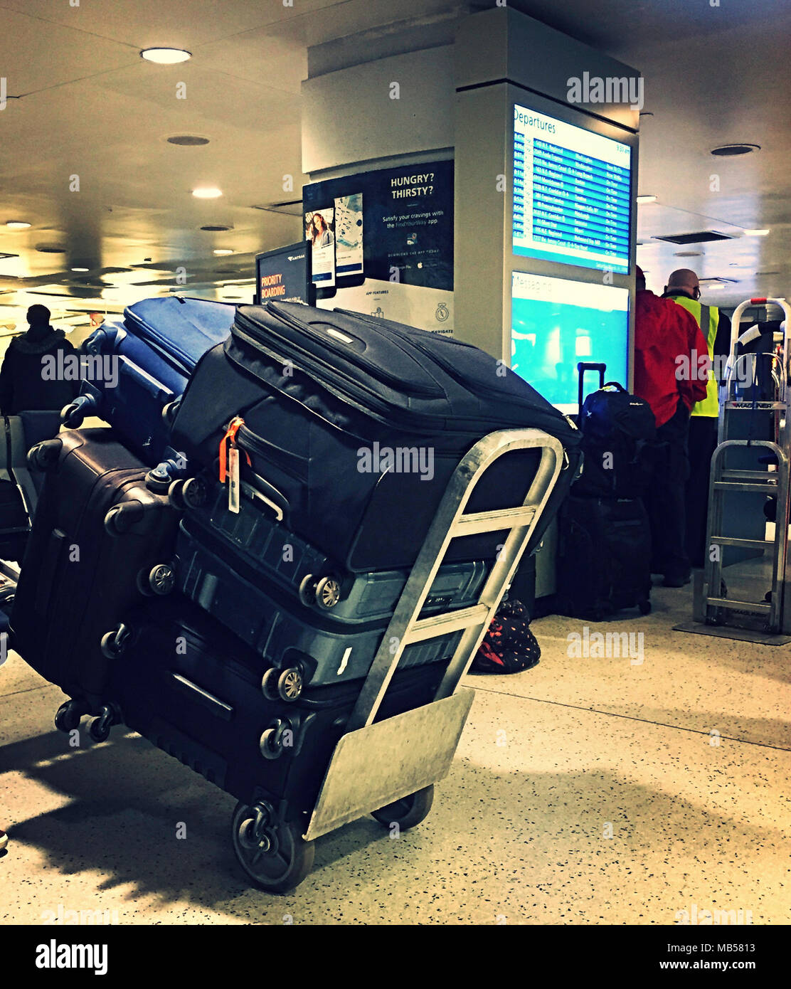 Red Caps and luggage, Waiting Room, Penn Station, NYC, USA Stock Photo