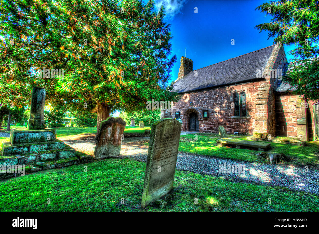 Village of Shocklach, Cheshire, England. Artistic dusk view the Grade I listed St Edith's Church. Stock Photo