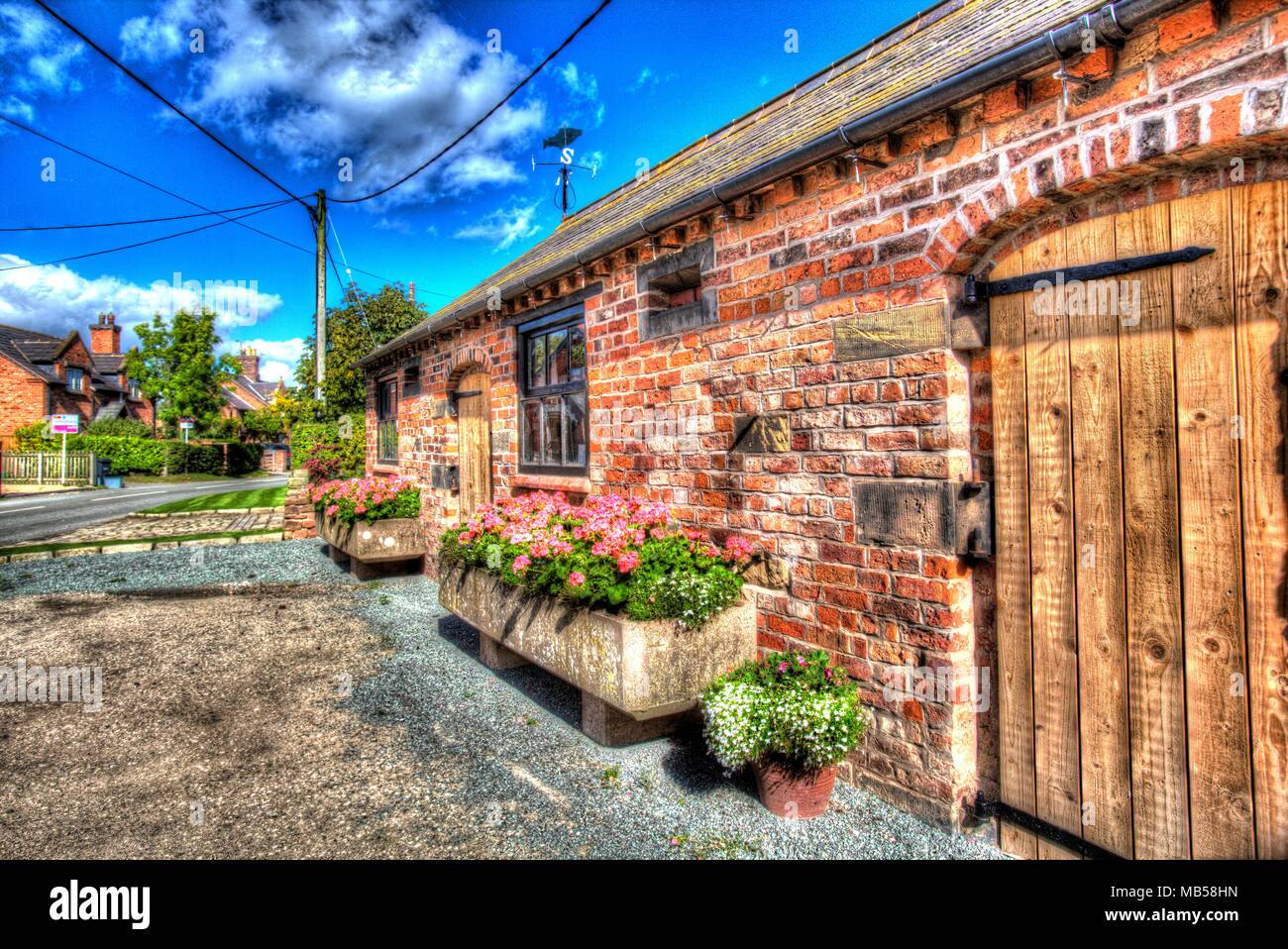 Village of Shocklach, Cheshire, England. Artistic view of a Converted barn house in the village of Shocklach. Stock Photo