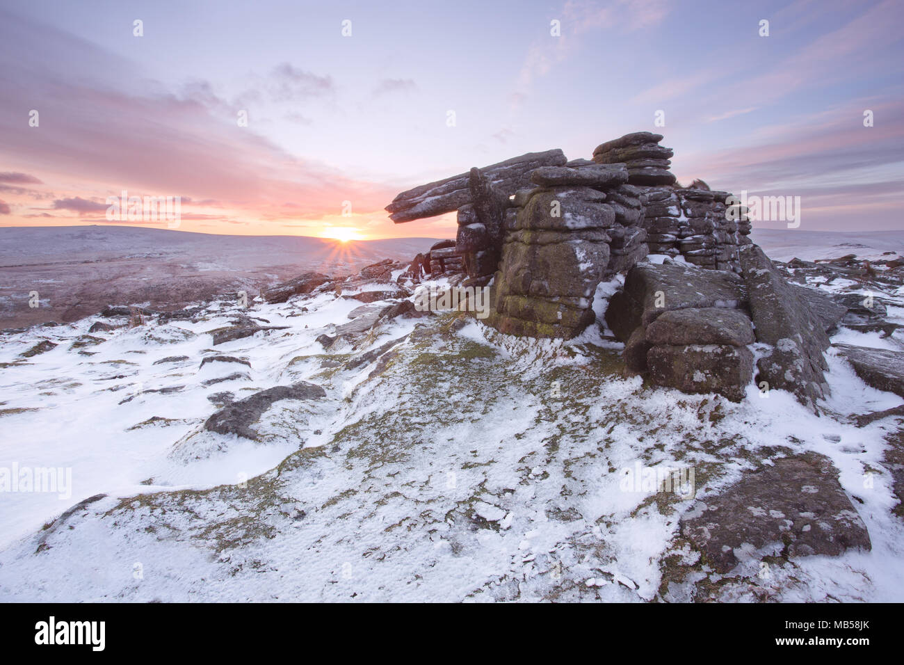 Winter snow on Belstone tor at sunrise, Dartmoor National Park Devon uk Stock Photo