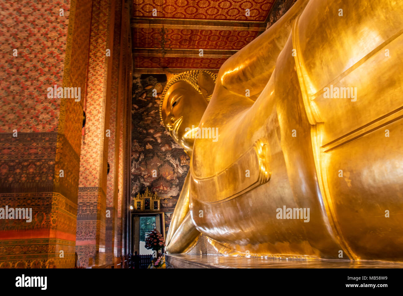 temple of wat pho and its reclining buddha that with its forty-six meters and fifteen centimeters is the largest lying buddha in thailand in the great Stock Photo