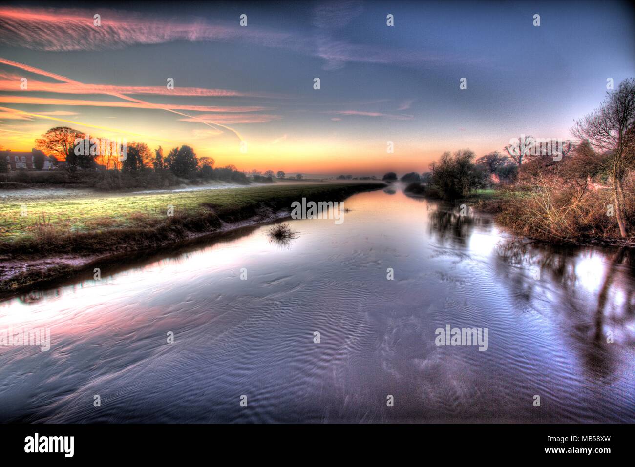 River Dee, England Wales border. Picturesque misty sunset view of the River Dee. Stock Photo