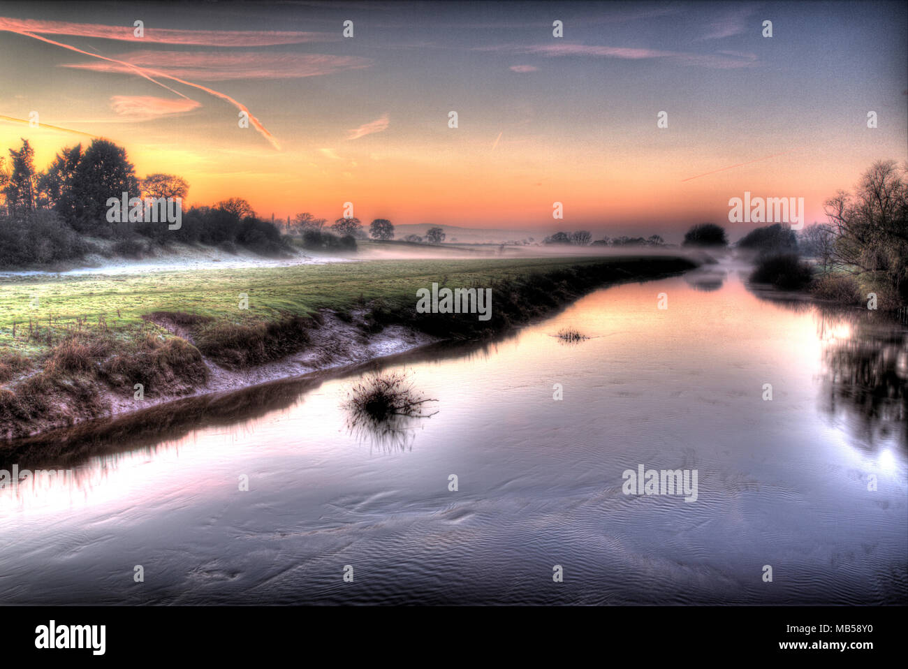 River Dee, England Wales border. Picturesque misty sunset view of the River Dee. Stock Photo