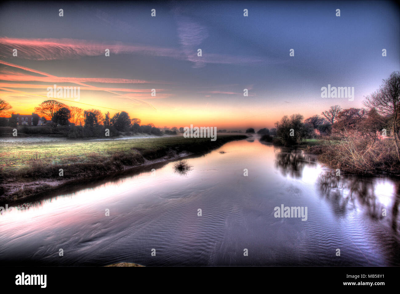 River Dee, England Wales border. Picturesque misty sunset view of the River Dee. Stock Photo