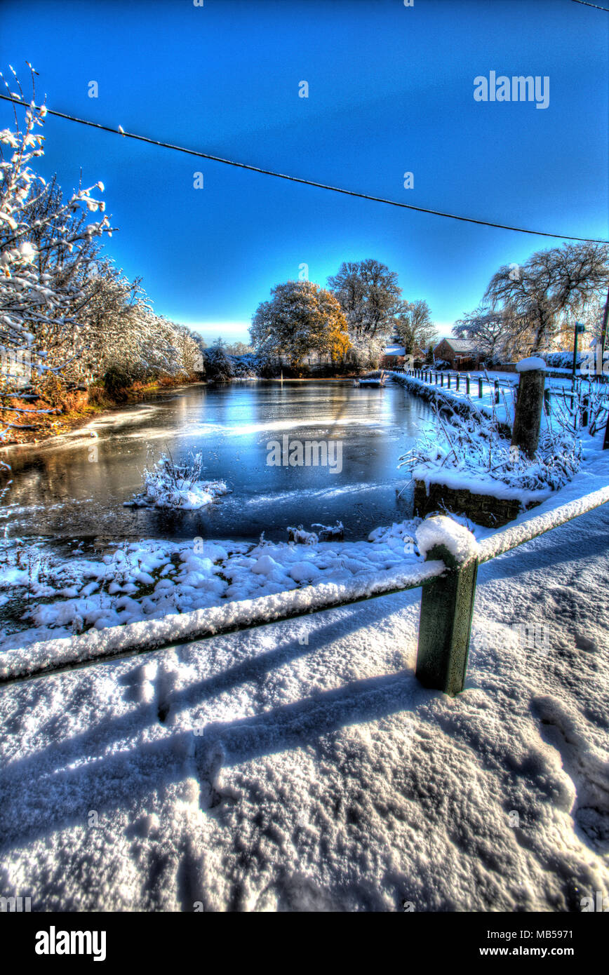 Village of Coddington, England. Artistic winter view of Coddington village pond in rural Cheshire. Stock Photo