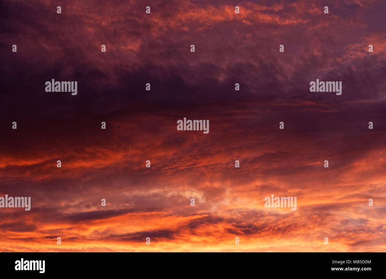 Dramatic sunset sky with evening sky clouds lit by bright sunlight Stock Photo