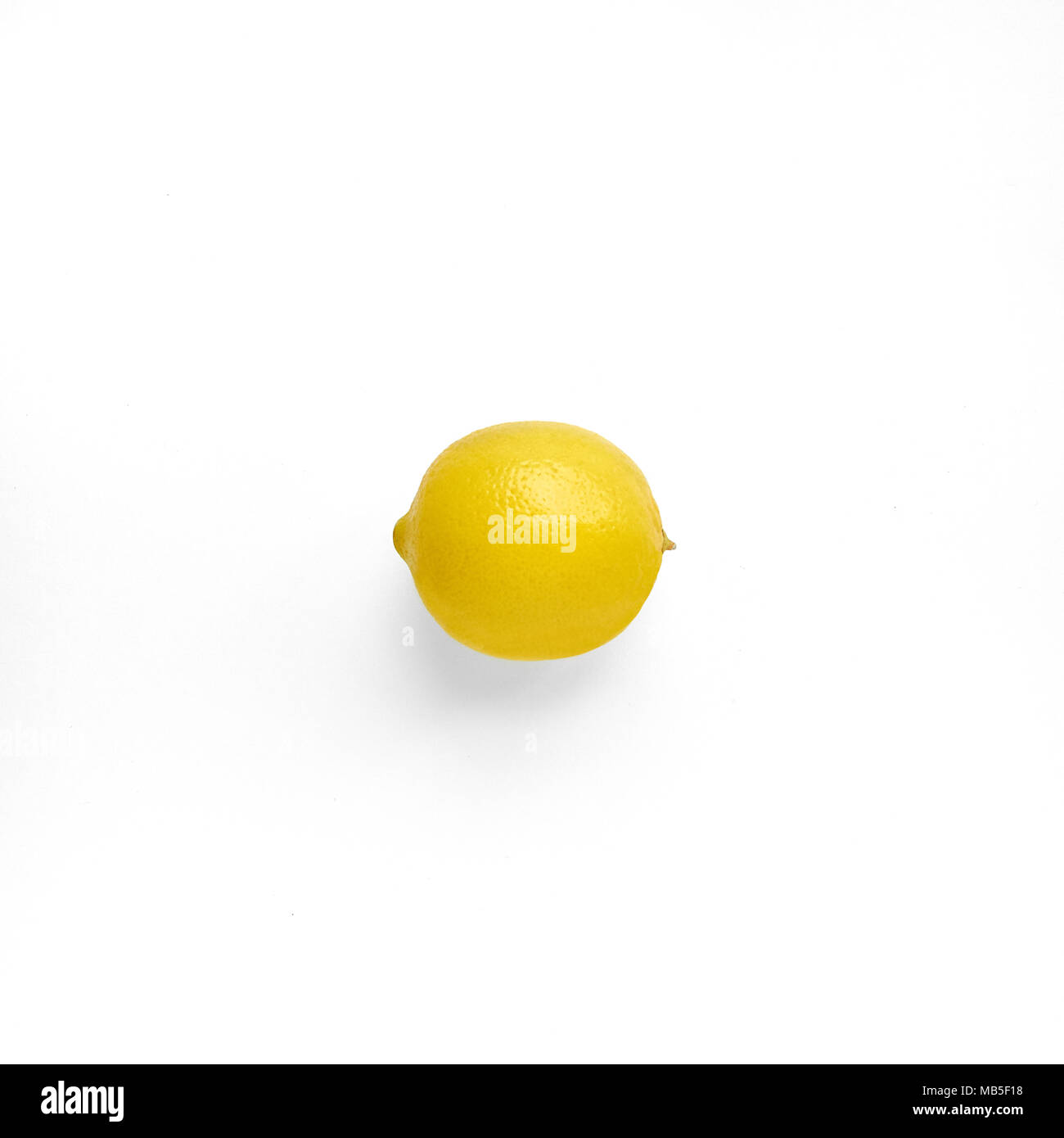 Photo mockup with one ripe lemon on white background Design template with copy space Flat lay Stock Photo