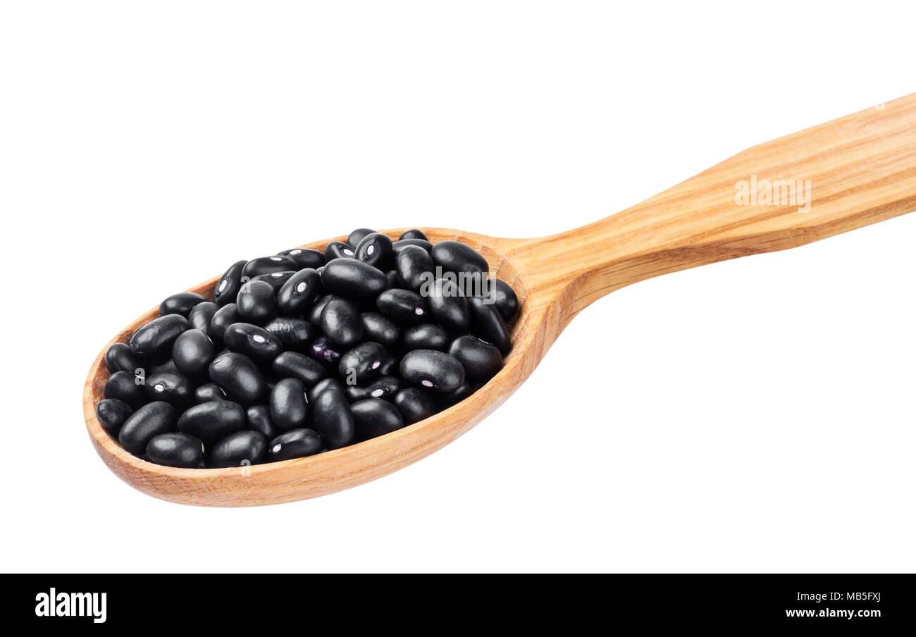 Black beans in wooden spoon isolated on white background Stock Photo