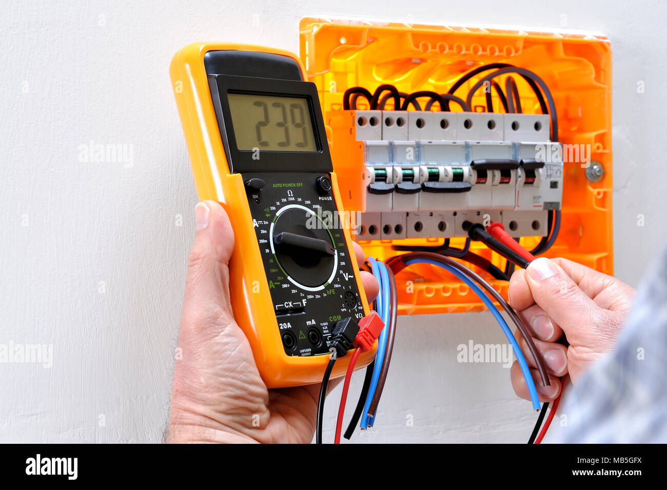 Electrician technician working on a residential electrical panel