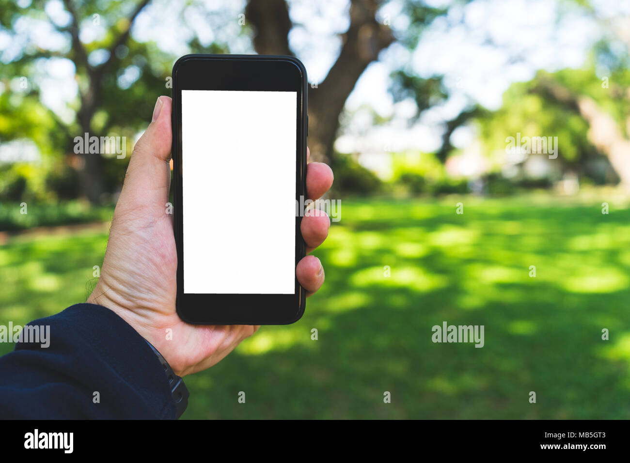 hand on smartphone Concept travel on vacation Stock Photo