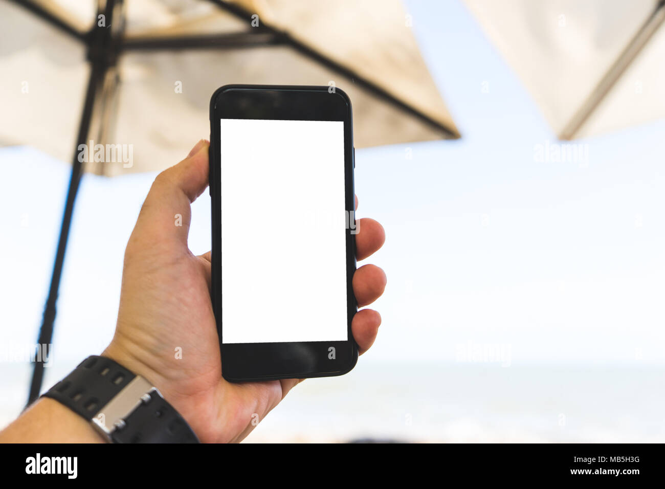 hand on smartphone Concept travel on vacation Stock Photo