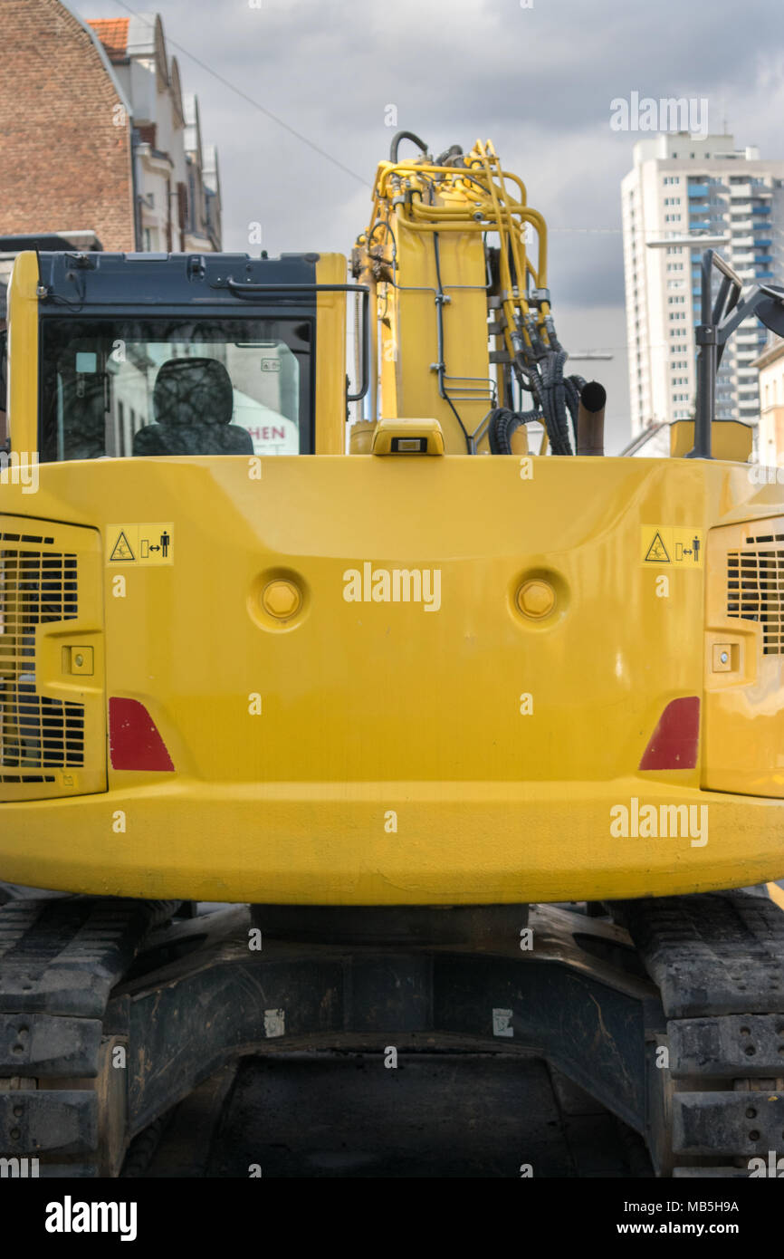Download Bright Yellow Excavator Behind Empty Mockup Advertising Space Public Transportation Vehicle Close Up Stock Photo Alamy