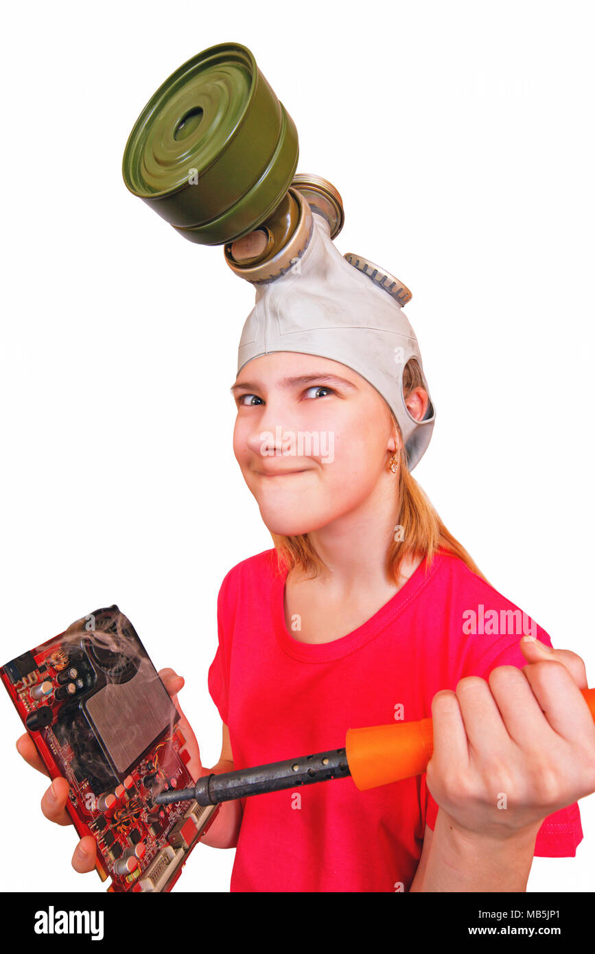 Comic, distortion: girl teenager wearing a gas mask pokes a soldering iron in an electronic video card.The desire to quickly identify the fault Stock Photo
