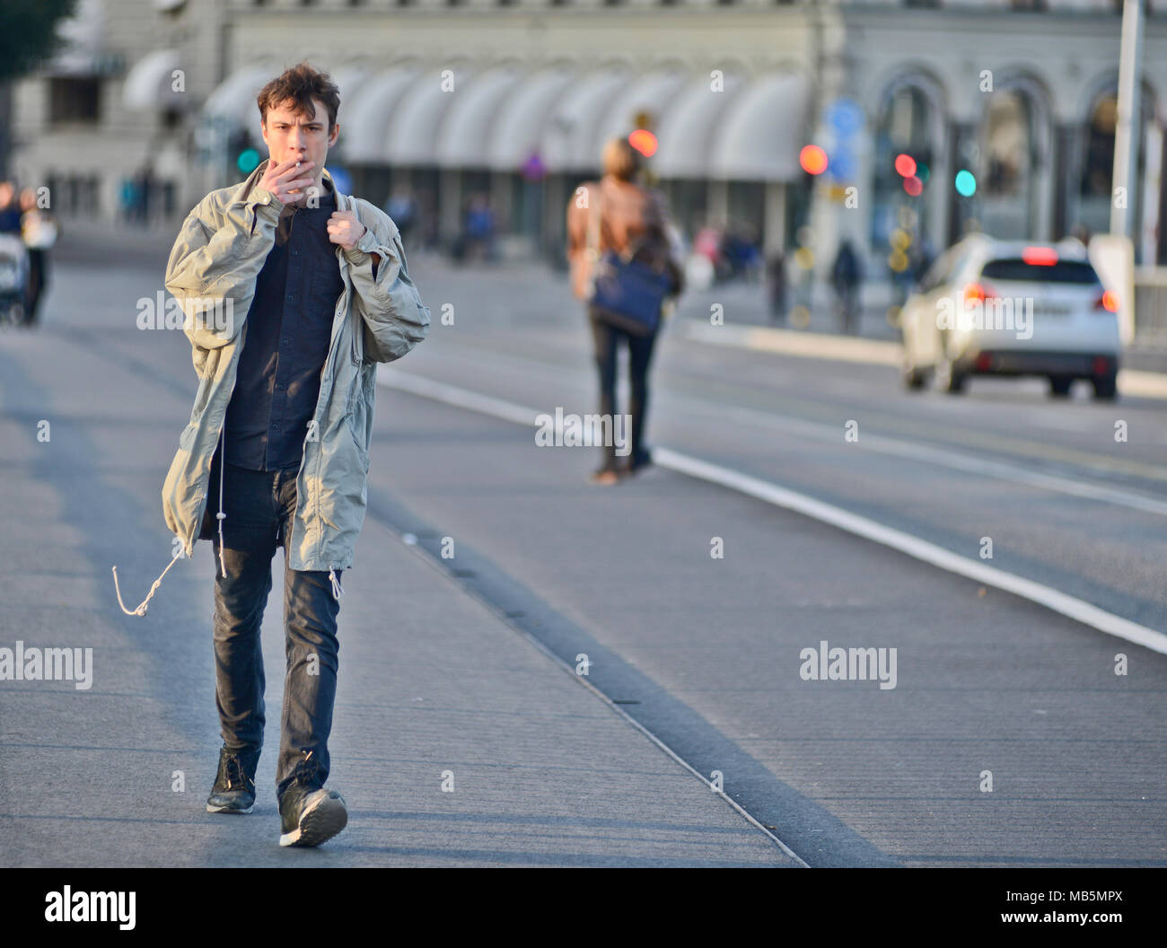 Smoking while walking hi-res stock photography and images