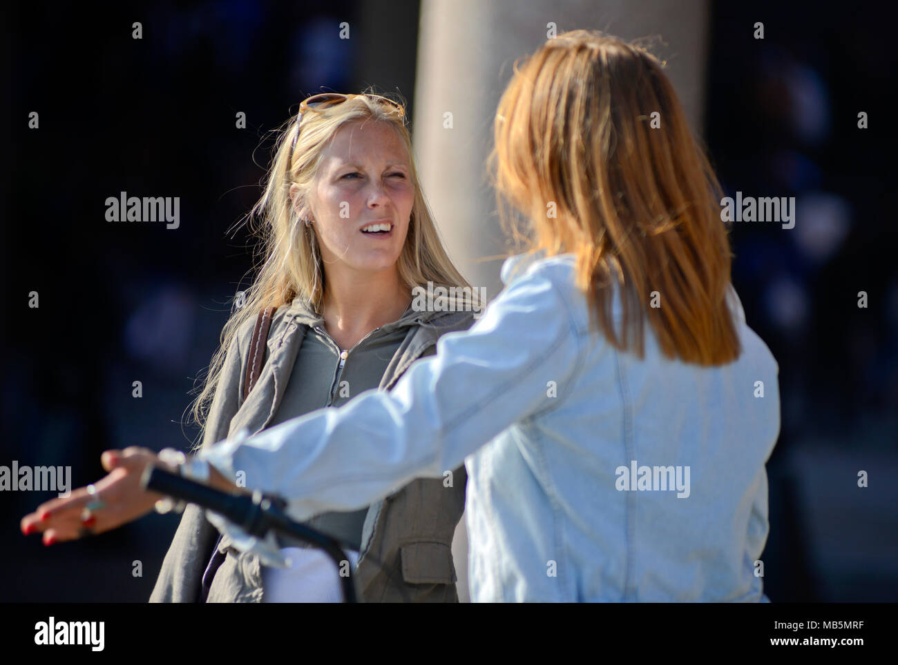 Women talking on the street, Stockholm, Sweden Stock Photo
