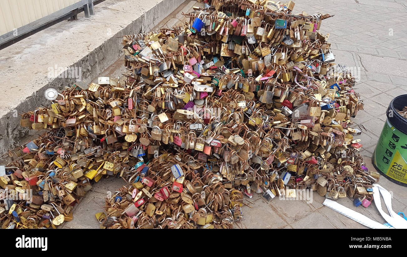Paris, France -  03 April, 2018. Workmen remove Padlocks on the bridge at Pont Neuf on 03 April 2018.  The first Iron bridge built in France, had its railings replaced with glass panels after they collapsed under the weight on the metal padlocks and this culture has cropped up in other bridges in Paris. General view of Paris, France. @ David Mbiyu/Alamy Live News Stock Photo