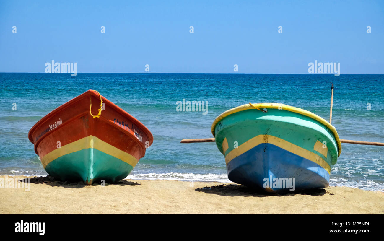 Colorful fishing boats on sand in the Dominican Republic Stock Photo