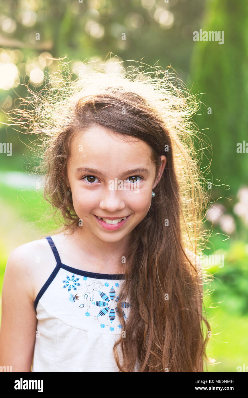 Happy Little Kid excited. Cute teen Girl smiling very happy on sunny Summer  background Stock Photo - Alamy