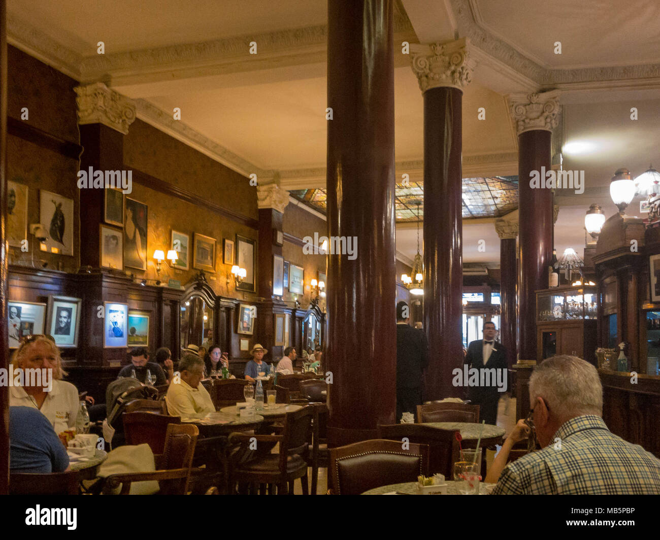 Stopping for a coffee in the famous Café Tortoni, in Buenos Aires (Argentina). Stock Photo